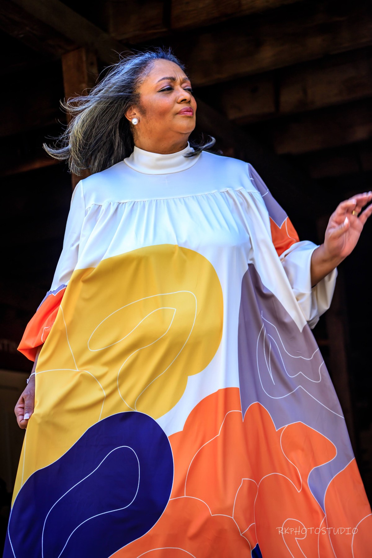 Teacher Cassandra Mitchell in a colorful dress